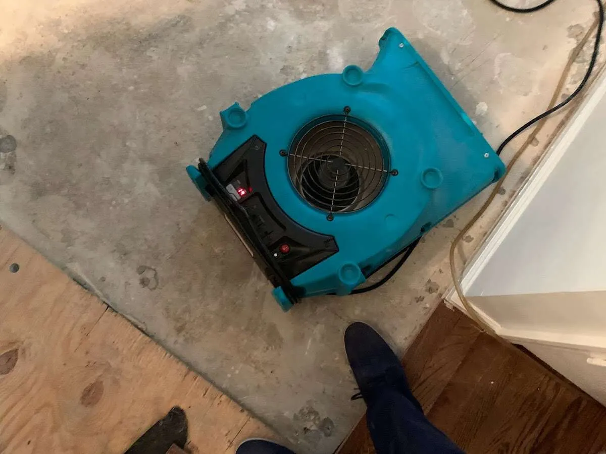 Air mover drying subfloor during Leak Detection & Repair in Hickam Housing